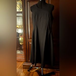 Sleeveless skater styled dress, hangs just above the knee